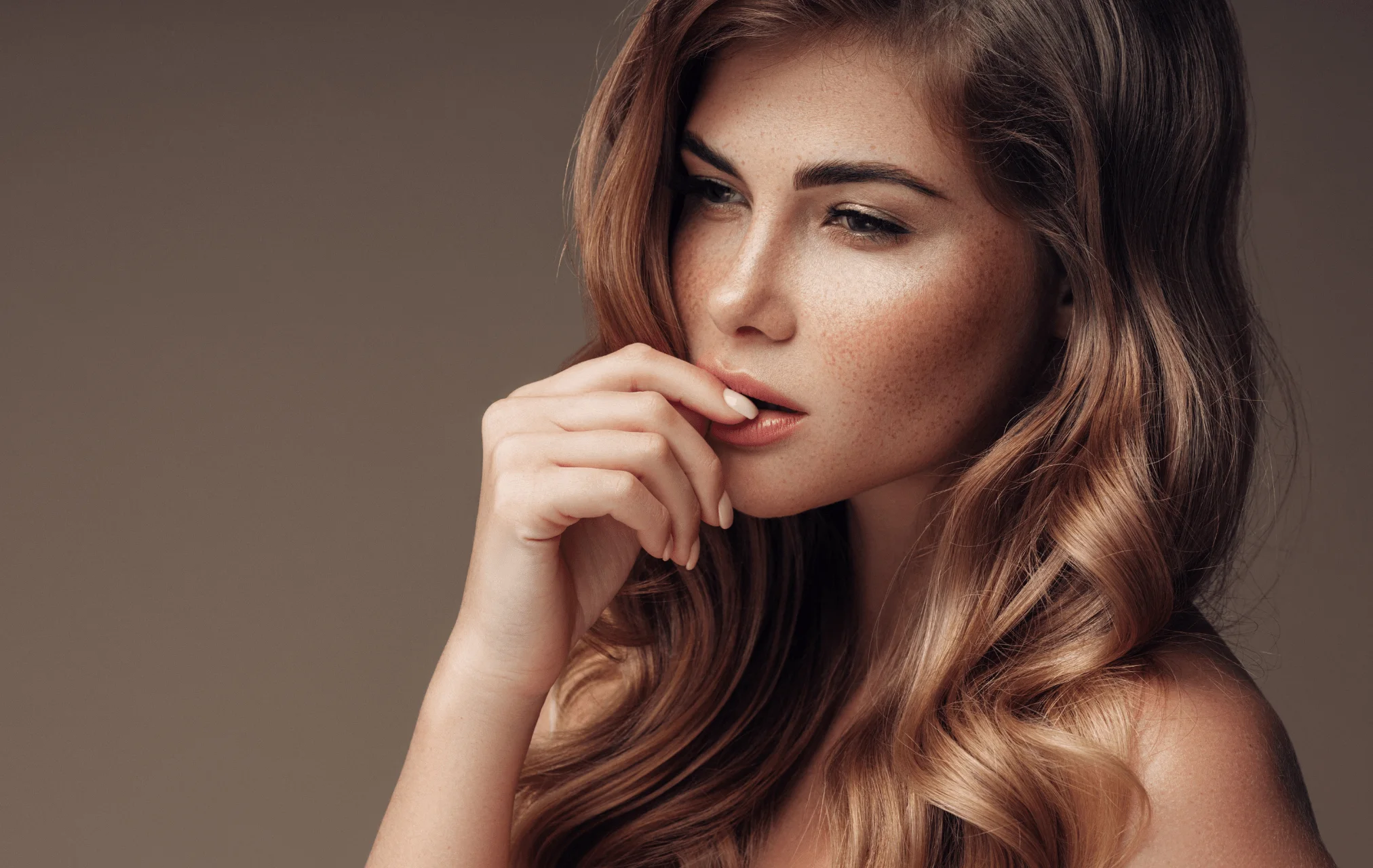 Woman highlighting natural-looking facial contours